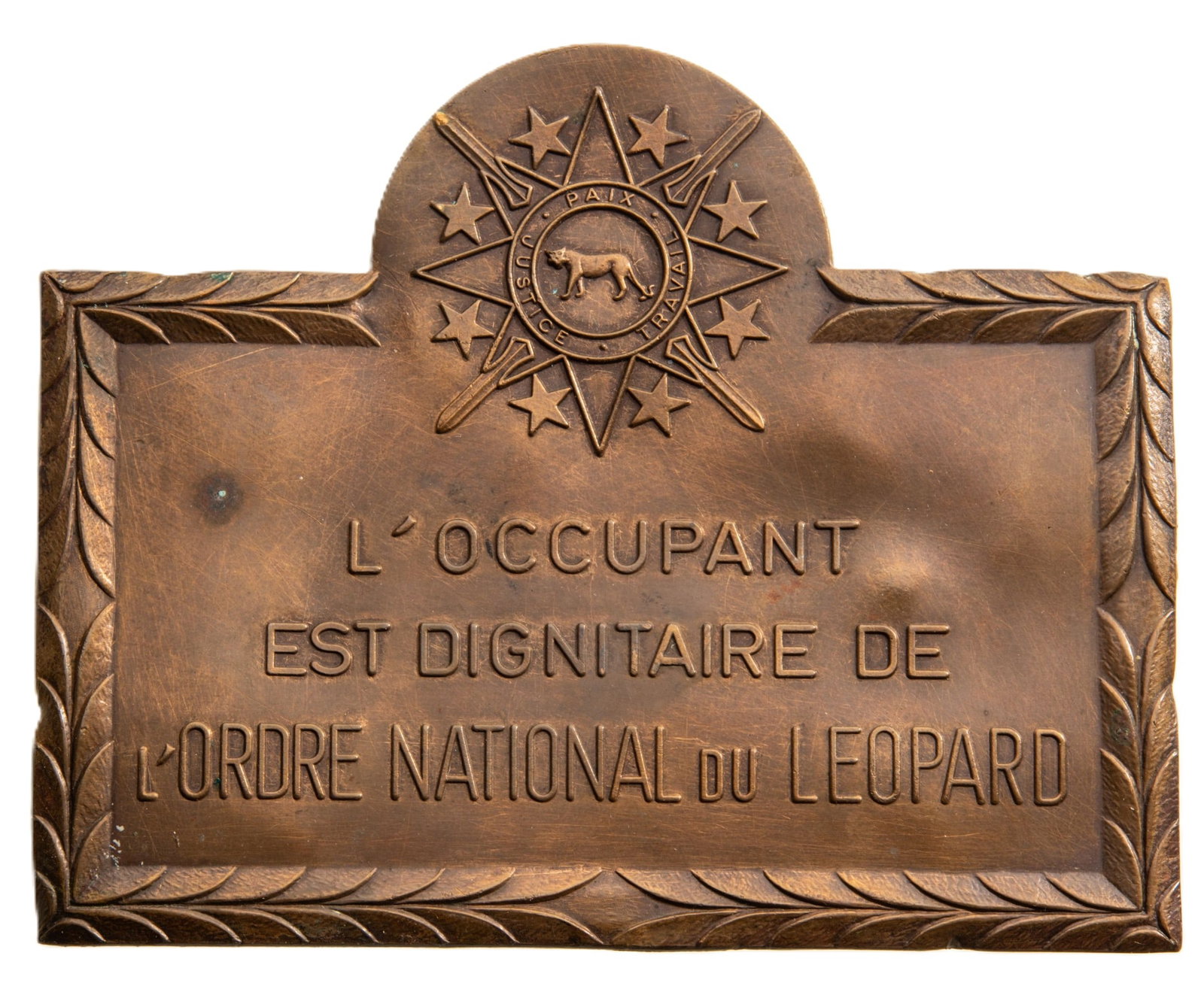 National Order of the Leopard: Nameplate of a recipient of the Order of the Leopard. Bronze 113x91 mm., original suspension metallic cords. An interesting and attractive object, in extremely fine condition! I