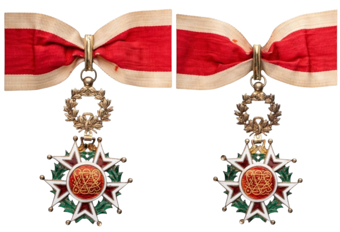 Order of the Brilliant Star of Zanzibar: Commander's Cross, instituted in 1963. Neck Badge, 67x42 mm., gil SIlver, enameled, original suspension wreath and ribbon. An interesting small sized commader's cross, of the highest jeweller's qualit