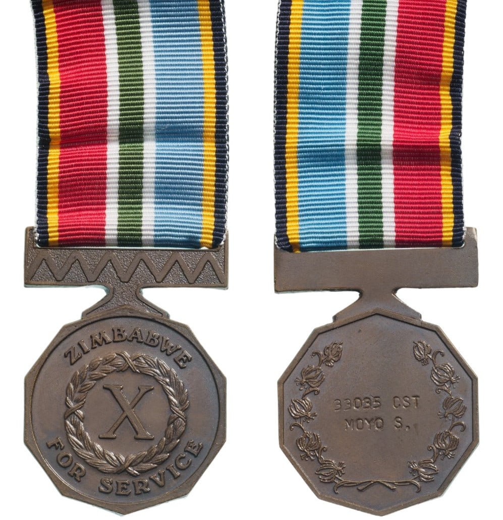 Service Medal: Breast Badge, 45x27 mm., Bronze, enameled, original suspension ring and ribbon. I