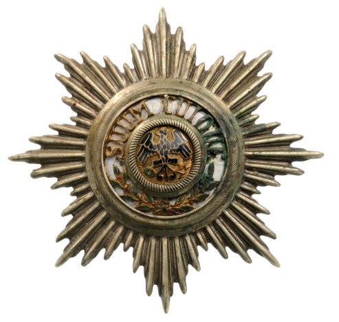 Star of the Order for Uniform Effects: Country: GERMANY Star of the Order for Uniform Effects Breast Star, silvered metal, multipart construction, central medallion enameled. Minor chipping to enamel. Patina and signs of wear. I