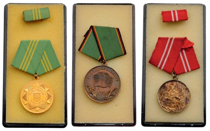 Medal for Long Service in Militarized Organs of the Min: Country: GERMANY Breast Badges, different materials, different sizes, original suspension ring and ribbon, in boxes of issue. (3) I ID : 1403751