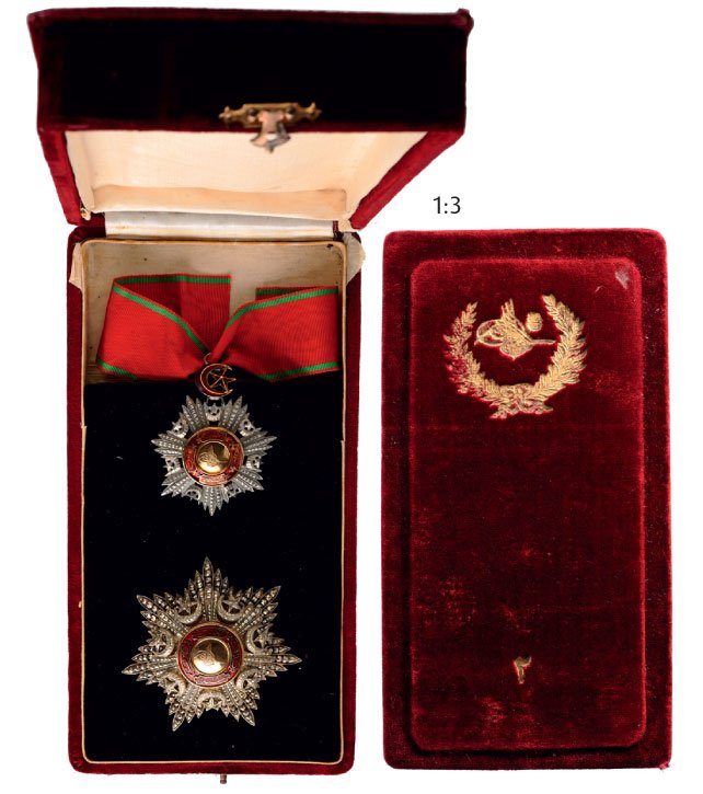 ORDER OF THE MEJIDIE: Grand Officer's Set, 2 nd Class, instituted in 1852. Neck Badge, 57 mm, silver with brilliant cut rays, central medallion, GOLD, enameled (minimal crack in the enamel), original star and crescent susp