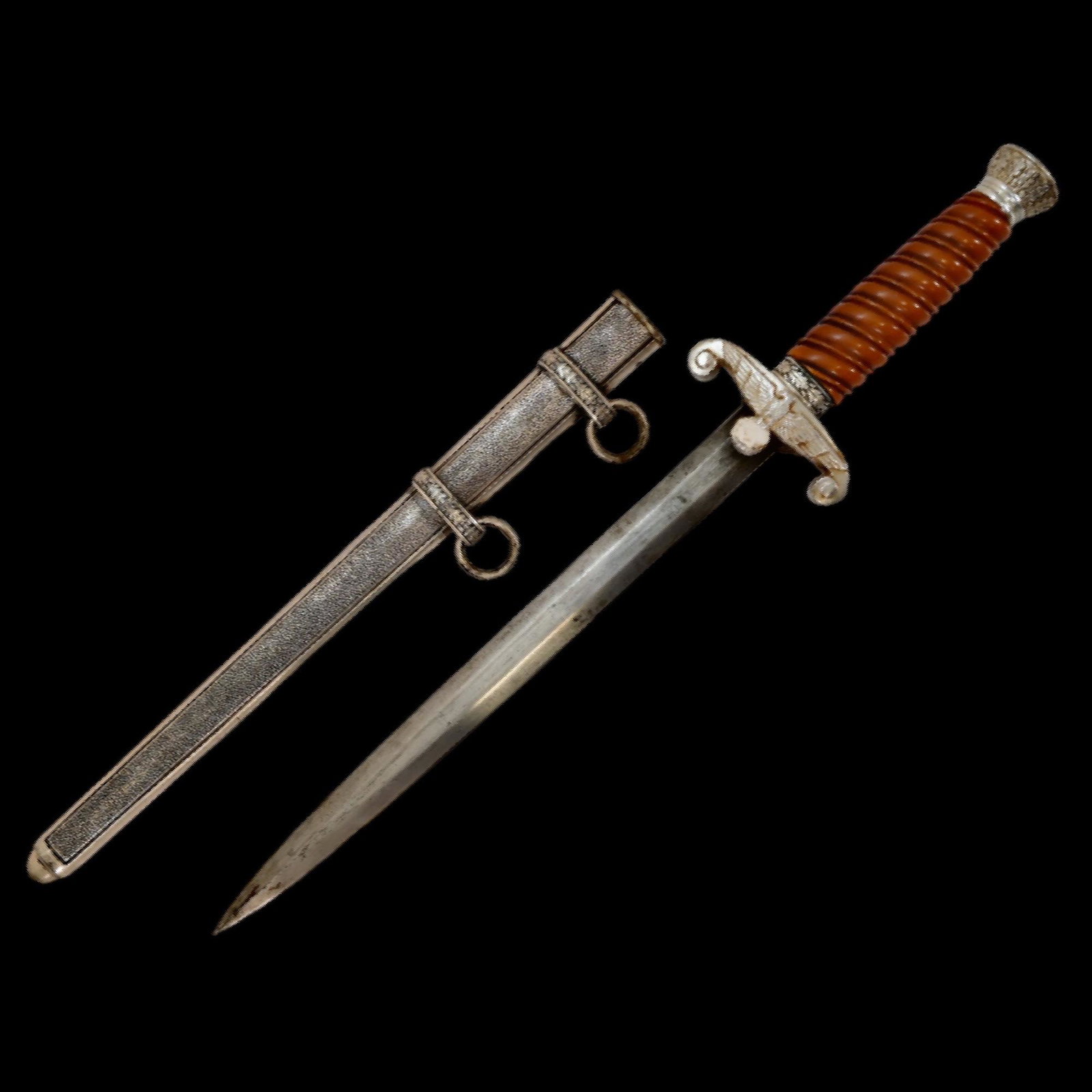 WW2 GERMAN ARMY OFFICER'S DAGGER WITH SCABBARD BY PUMA OF SOLINGEN, 1935 PATTERN. THIRD REICH.: WW2 GERMAN ARMY OFFICER'S DAGGER WITH SCABBARD BY PUMA OF SOLINGEN, 1935 PATTERN. THIRD REICH. Features good condition nickel fittings overall, with dark orange grip and eagle cross guard. The guard i