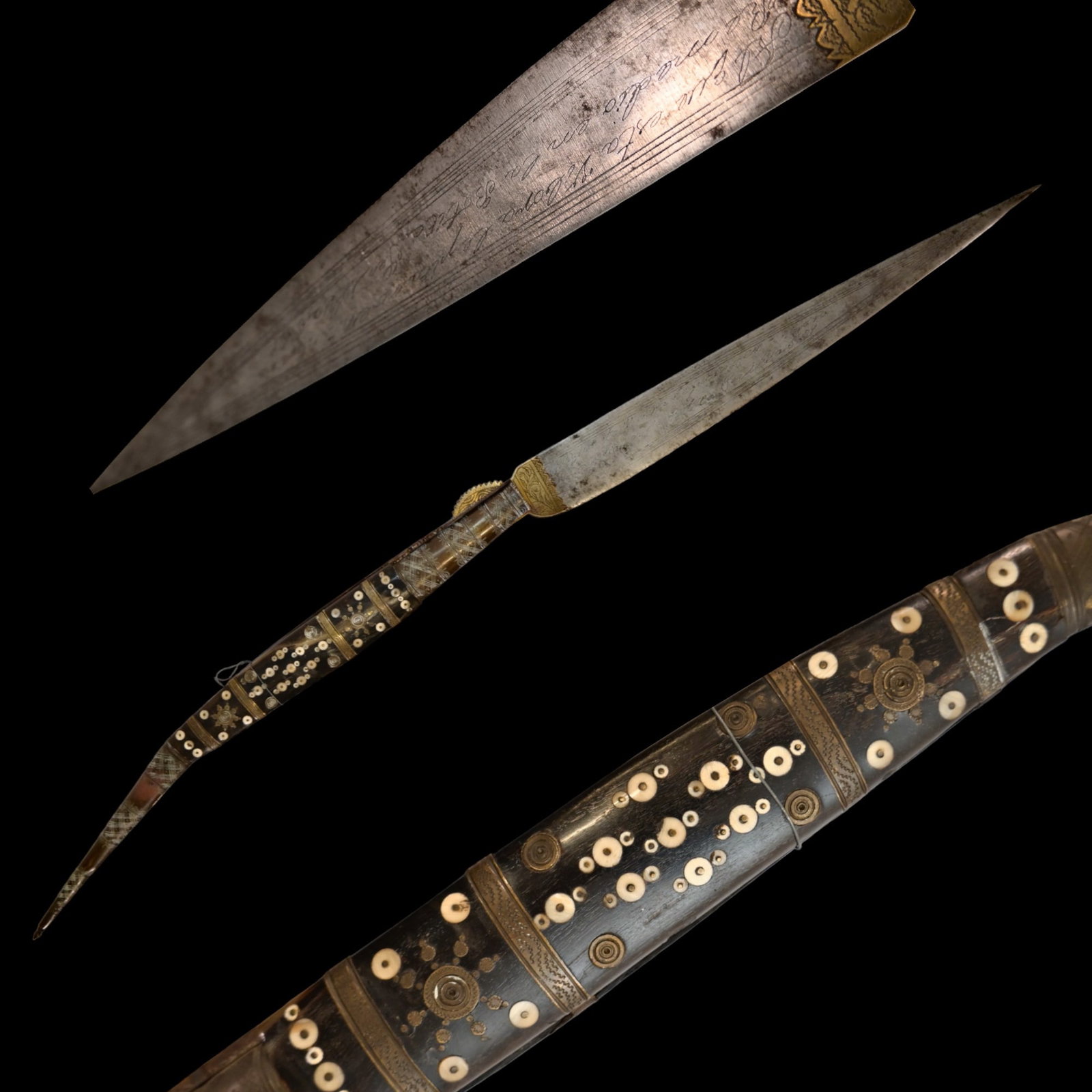 A high quality very large Spanish navaja, 1884.: A high quality very large Spanish navaja, 1884. The steel blade with inscription and date 1884, decorated with engraving. The horn hilt is richly inlaid with bone inlays and silver fittings. Beautiful
