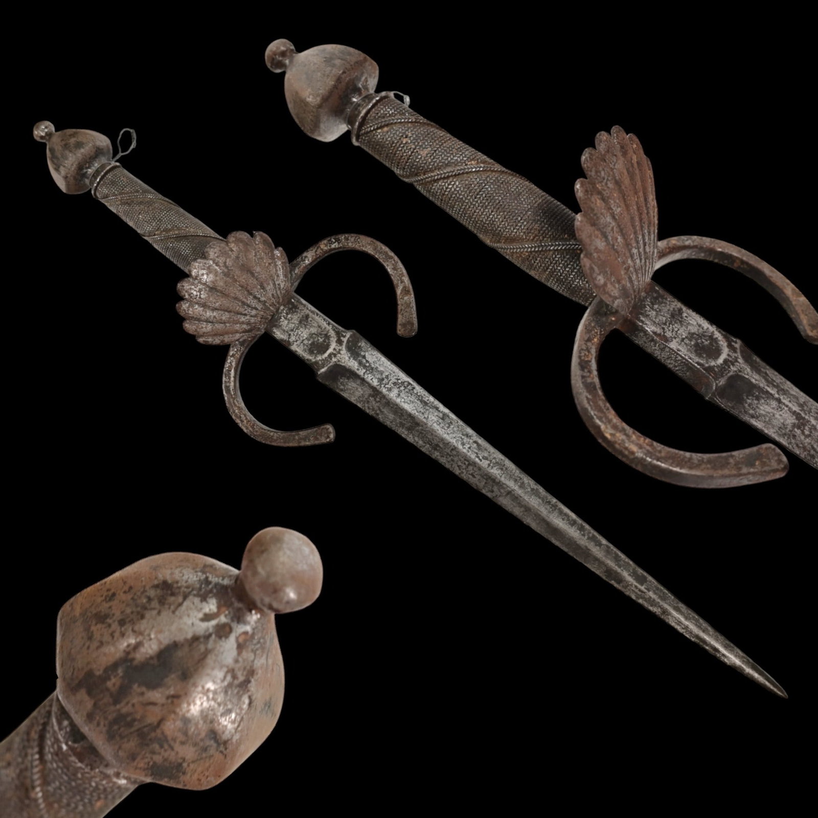 A LARGE ITALIAN LEFT HAND DAGGER, 17TH CENTURY.: A LARGE ITALIAN LEFT HAND DAGGER, 17TH CENTURY. Straight double-edged steel blade. Guard with flattened ends and a shell-shaped protective shield. Wooden handle wrapped with silver wire, steel pommel.
