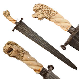 Rare Cinquedea type Sword, 16-17th Century, Italy.: Rare Cinquedea type Sword, 16-17th Century, Italy. Wide, double-edged blade with three fullers on each side. The iron guard is skillfully made. Fine bone pommel carved in the shape of a lion's head. R