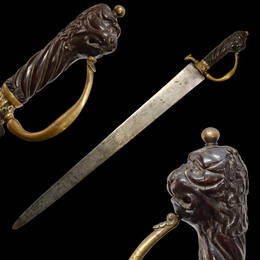 An important large size Hunting Sword with a carved lion's head, France, 17th Century.