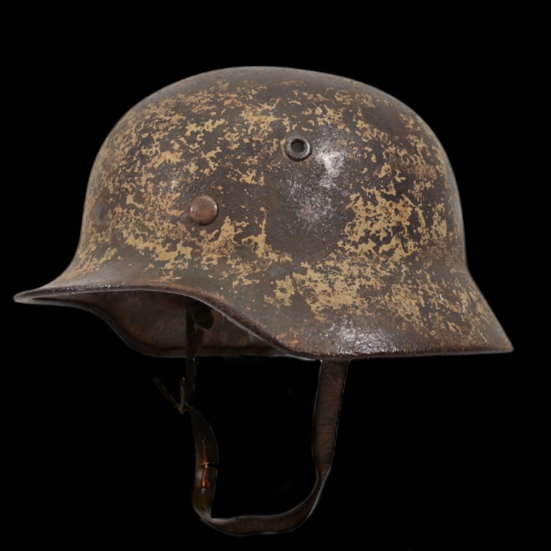 Rare WWII Nazi German M35 Combat Helmet with tropical color, with liner and chin strap.: Rare WWII Nazi German M35 Combat Helmet with tropical color, with liner and chin strap. The emblem on the left side are lost. The helmet has a partially lost matt tropical paint finish to the exterior