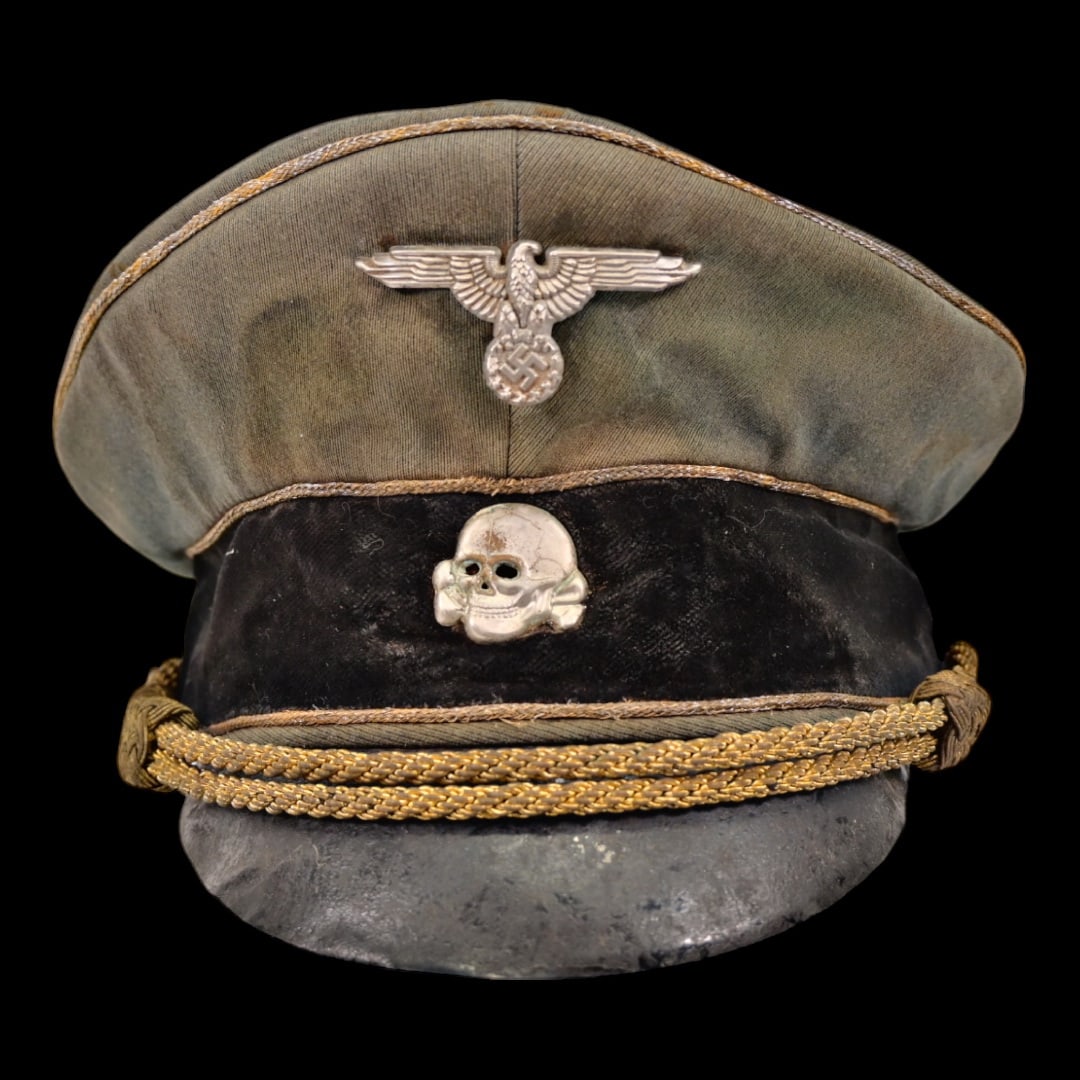Extra Rare WWII Nazi German SS General's Officers visor cap.: Extra Rare WWII Nazi German SS General's Officers visor cap. Has Reichsadler and Totenkopf cap badges. The body is a very fine wool blend material, gold plated wire piping to the crown edge and both t