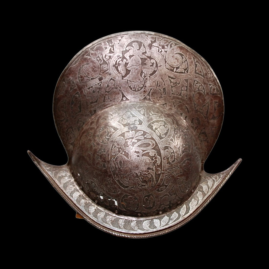 A Italian helmet Morion, second half of the 16th century.: Italian helmet Morion, second half of the 16th century. Decorated with etching, engraving and gilding. Losses.