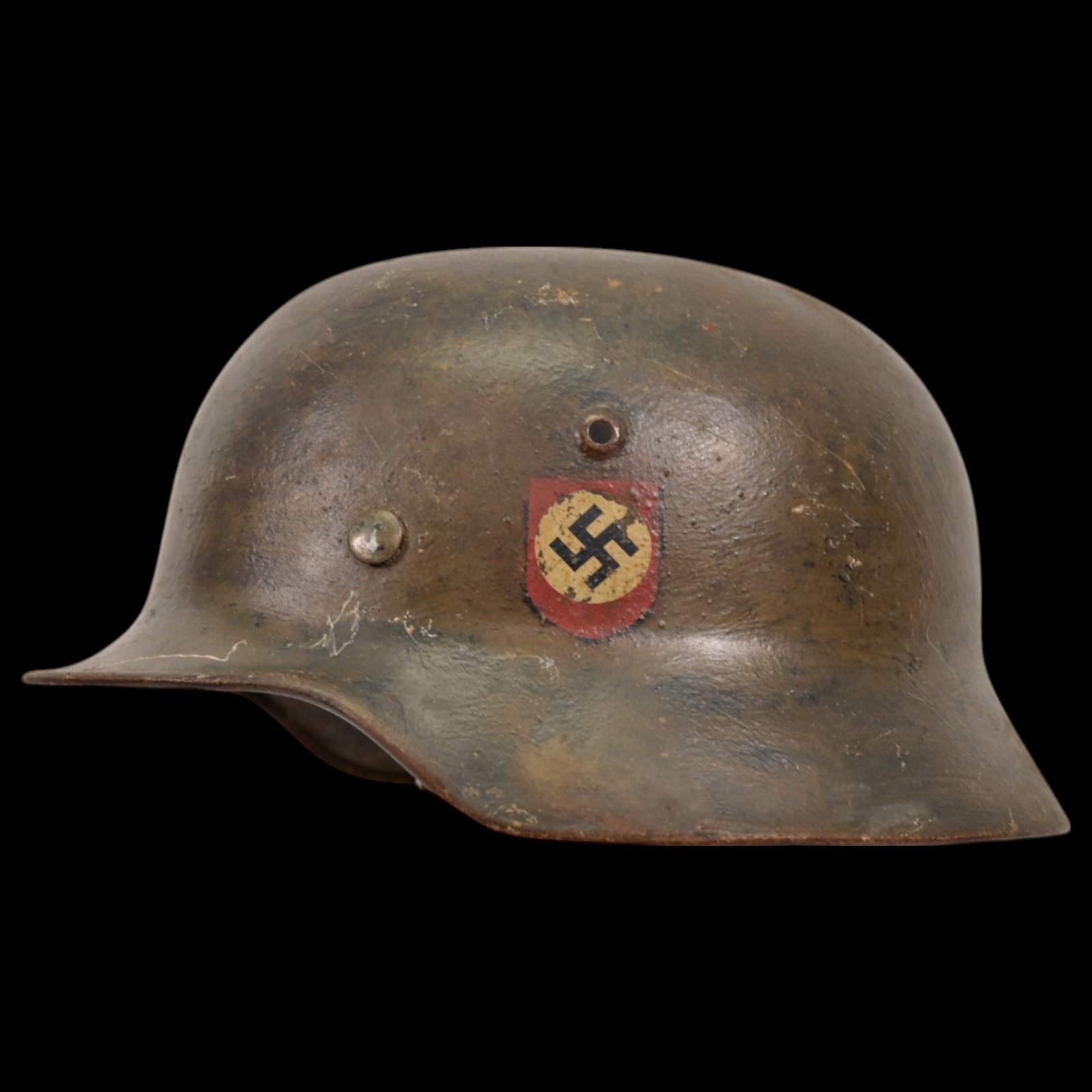 WWII Nazi German M40 SS Combat Helmet with SS emblems on the sides.: WWII Nazi German M40 SS Combat Helmet with SS emblems on the sides. The helmet shows signs of wear. This helmet is a significant piece of WWII militaria, representing the Waffen-SS forces. It is an ex