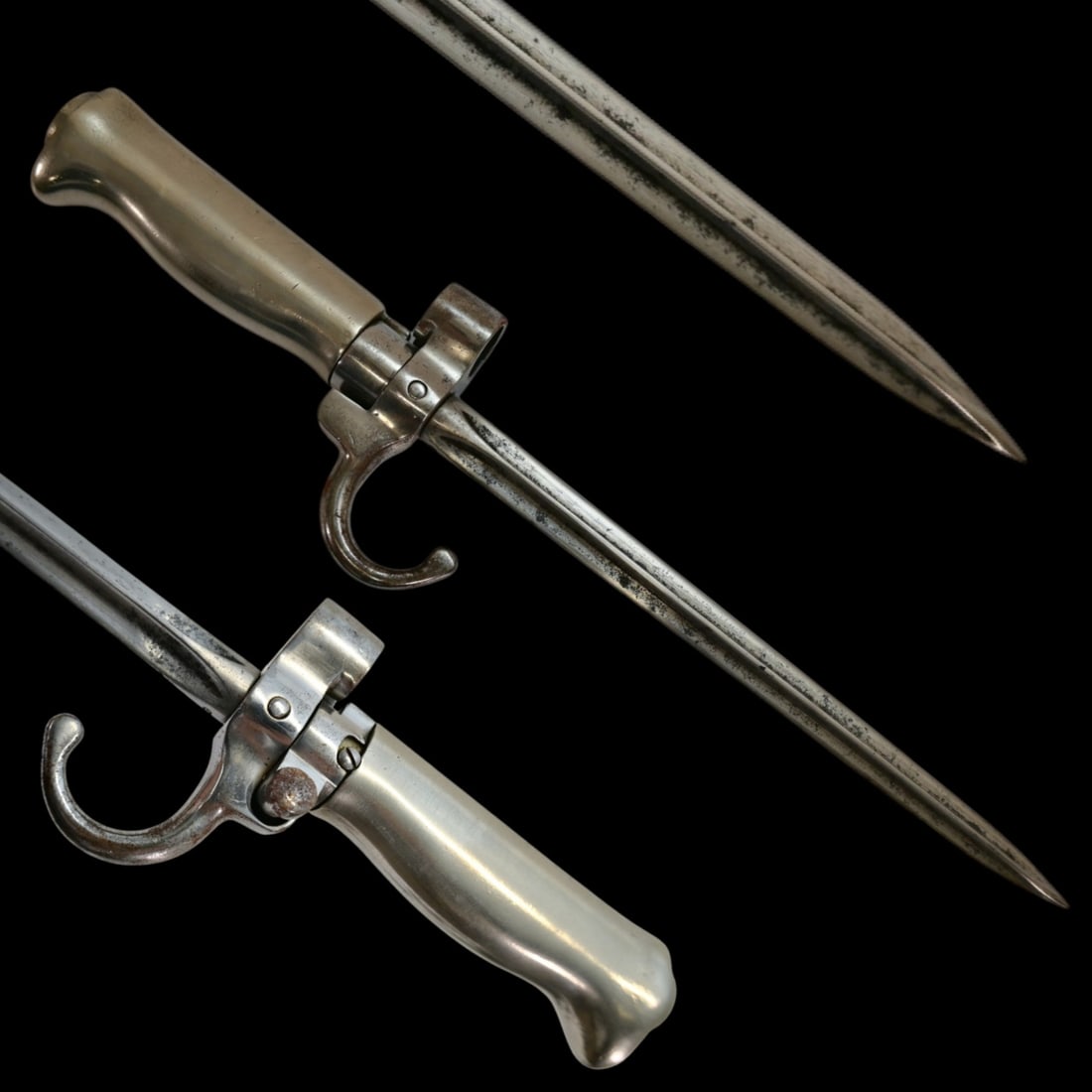 A French Model 1886 Lebel rifle, Bayonet, Shortened.: A French Model 1886 Lebel rifle, Bayonet, Shortened. The bayonet features removable silver alloy grips, with the locking lug (working). Metal quillon and muzzle ring showing issue numbers & manufactur