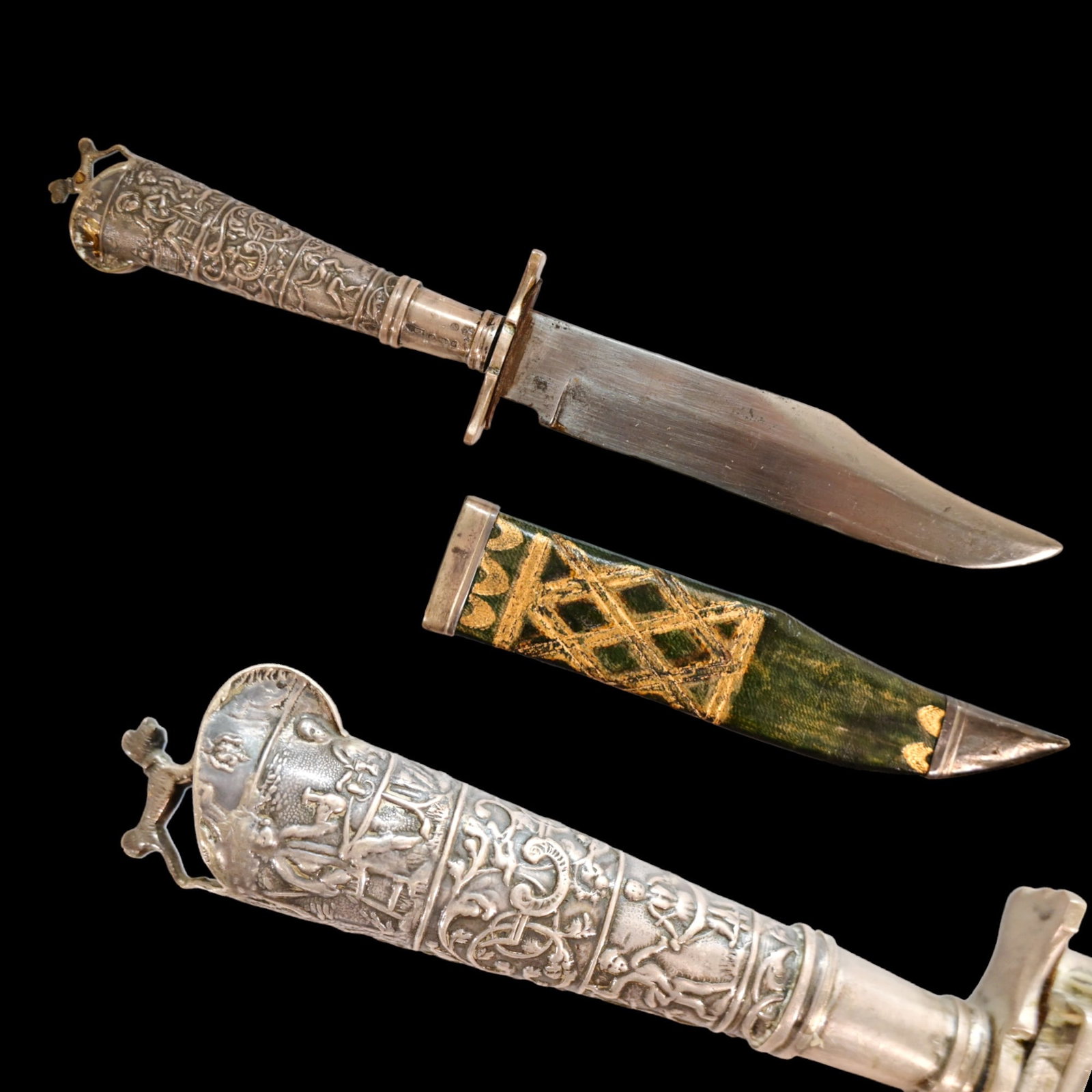 A silver mounted hunting knife, France 19th century.: A silver mounted hunting knife, France 19th century. Straight, steel blade sharpened from one edge. A magnificent silver handle with hallmarks, richly decorated with chasing and engraving, on the top 