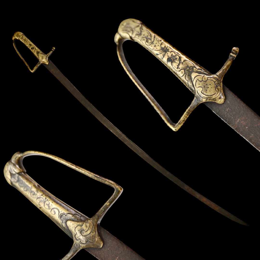 A rare, children's Polish or Russian Empire saber, 18th century.: A rare, children's Polish or Russian Empire saber, 18th century. The slightly curved steel blade with fuller. The bronze hilt consists of a handle and guard decorated with engraved ornaments in the Ro
