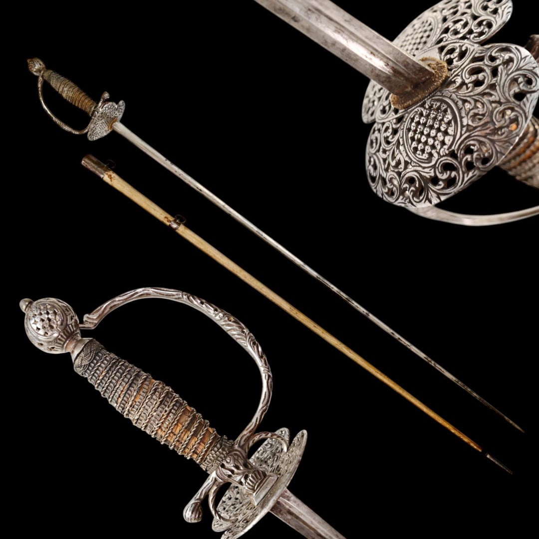 A Perfectly preserved Sword with Scabbard, Openwork steel, France, 18th century.: A Perfectly preserved Sword, Openwork steel, France, 18th century. The blade of the sword is steel, triangular with fullers on each side, tapering towards the end. The pommel is hollow with perforated