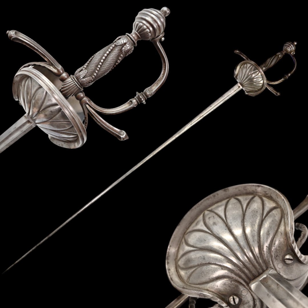 A Beautiful Rapier, Spain, 18th-19th century.: A Beautiful Rapier, Spain, 18th-19th century. The long, straight, steel blade with one fuller on each side. Iron hilt with round pommel. Wooden handle wrapped with iron wire. High-quality hilt with pr