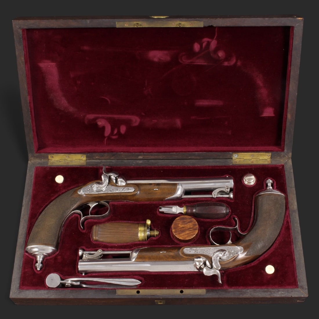 A Fine Cased Pair of French Percussion Pistols by A. Camus, Paris, Mid-19th Century.: A Fine Cased Pair of French Percussion Pistols by A. Camus, Paris, Mid-19th Century. This elegant pair of mid-19th-century percussion target pistols represents the magnificent example of Parisian gunm