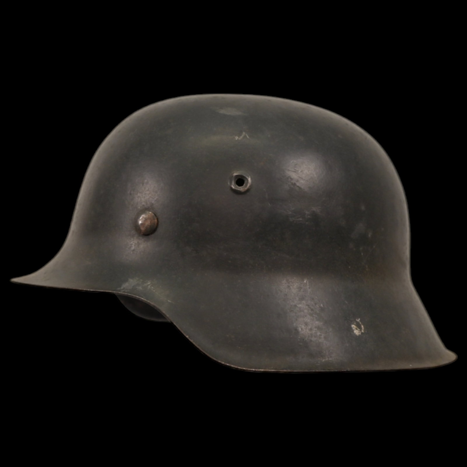 WWII Nazi German M42 Combat Helmet. The helmet shows signs of wear.: WWII Nazi German M42 Combat Helmet. The helmet shows signs of wear. The helmet retains its liner, adding to its authenticity. This helmet is a significant piece of WWII militaria. It is an excellent e
