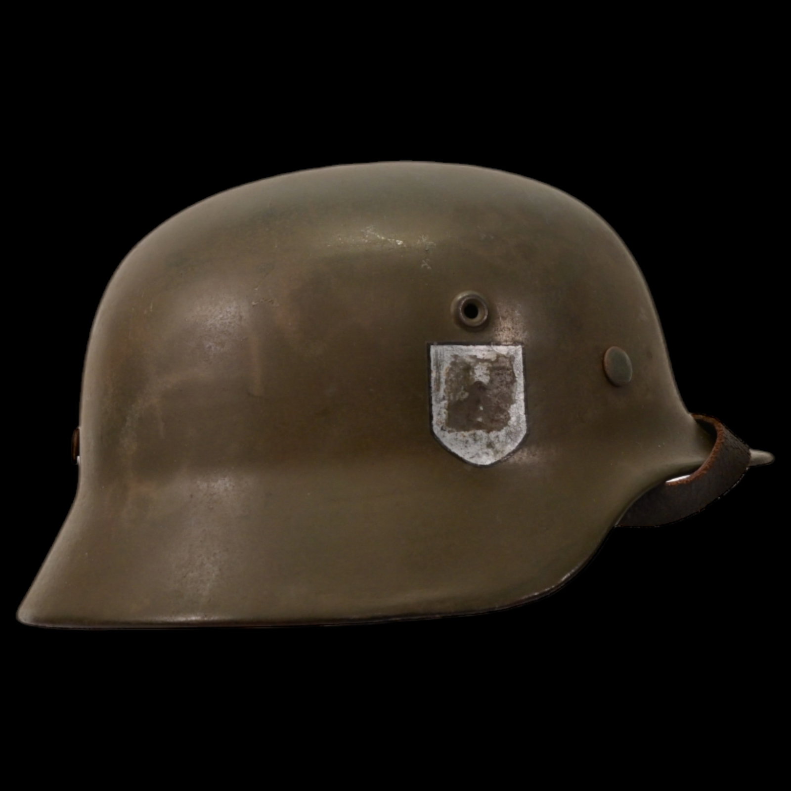 WWII Nazi German M40 Waffen - SS Combat Helmet with SS emblem on the side, liner and chin strap: WWII Nazi German M40 Waffen - SS Combat Helmet with SS emblem on the side, liner and chin strap. The emblems SS on the right side of the helmet. The rear inner skirt is stamped. The leather liner insi