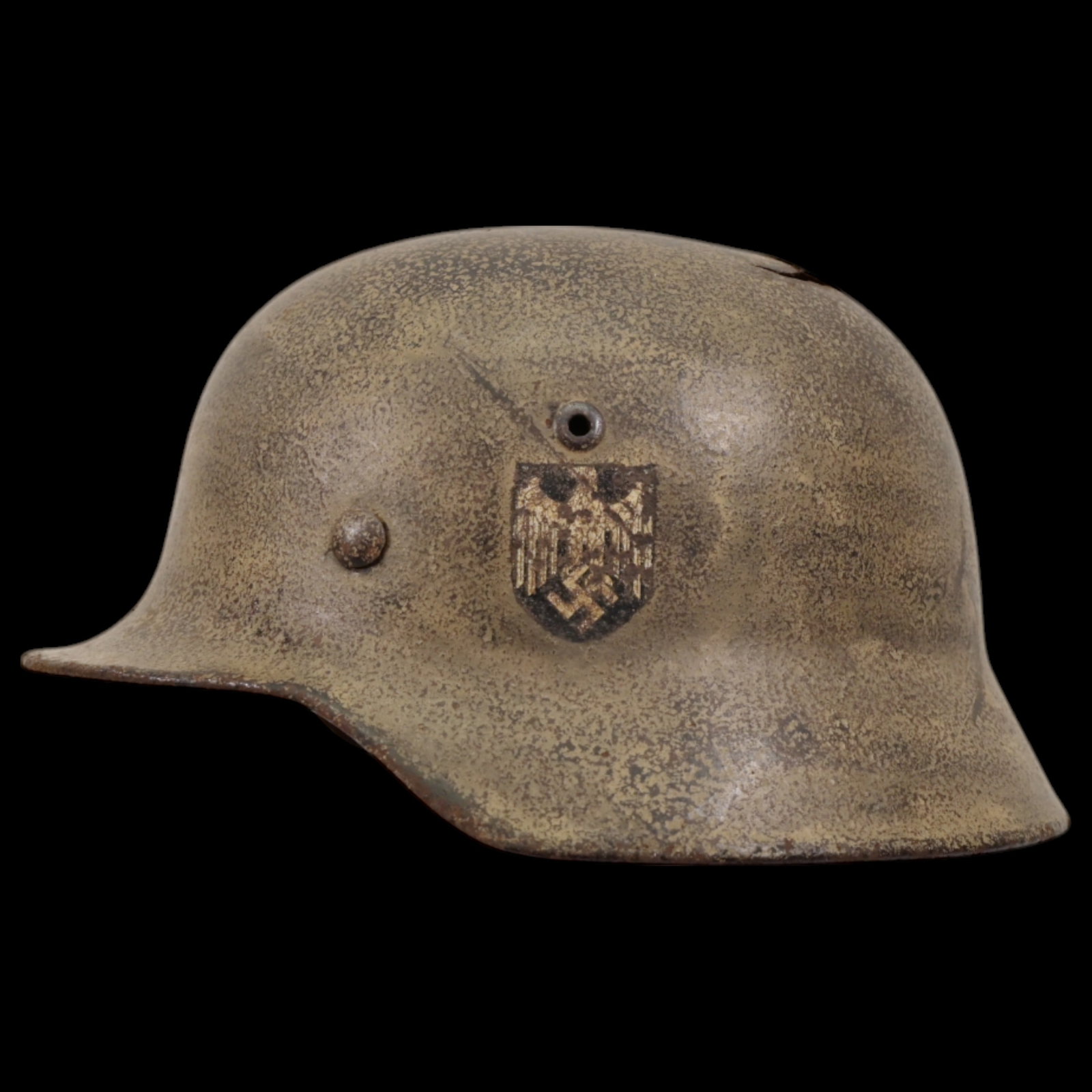 Rare WWII Nazi German M35 Helmet, With Liner.: Rare WWII Nazi German M35 Helmet, With Liner. The upper part of the helmet is damaged, see photo. The emblem on the left side. The leather liner inside has damage and has an description, probably the 