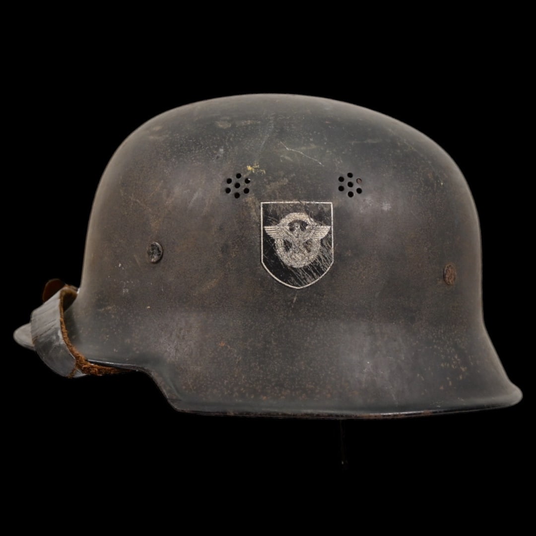 WWII Nazi German Fireman M34 Helmet, FEUERSCHUTZPOLIZEI HELMET.: WWII Nazi German Fireman M34 Helmet, FEUERSCHUTZPOLIZEI HELMET. This helmet retains its original liner and chinstrap, enhancing its authenticity as a well-preserved relic. A stamp with the number 56 i