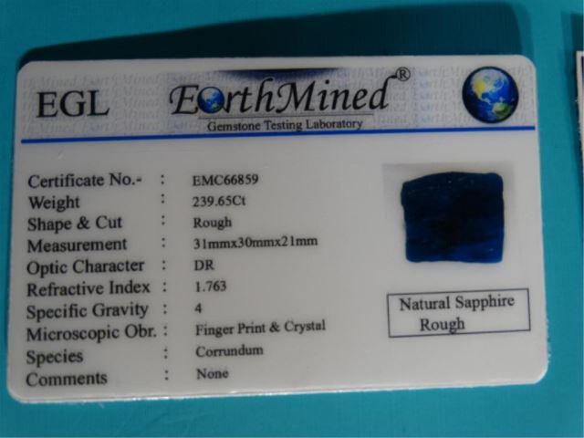 Natural Rough Blue & Oval Cut Orange Sapphires: ( 2 x $) Both of these authentic natural Sapphires are certified. The rough Blue Sapphire is 239.65 cts and is partially translucent and will make a beautiful jewelry. The oval cut Orange Sapphire is 