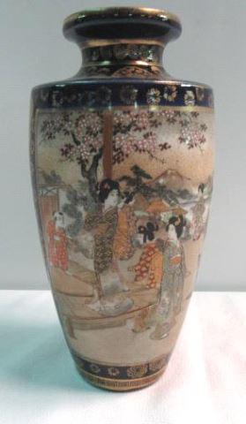 Japanese Satsuma Hand Painted 8-1/2" High Vase: Ivory bodied clay base with hand-painted gilded polychromatic enamel overglaze designs over a cobalt base.