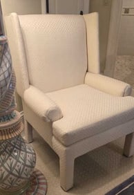 Neutral upholstered design with straight lines that give a modern vibe. Armrest covers are included