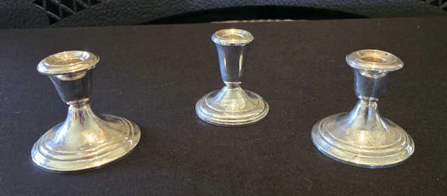 L-R: Gorham Sterling, Cement Reinforced with Rod of Other Metal 661, 312g Weighted; Garden