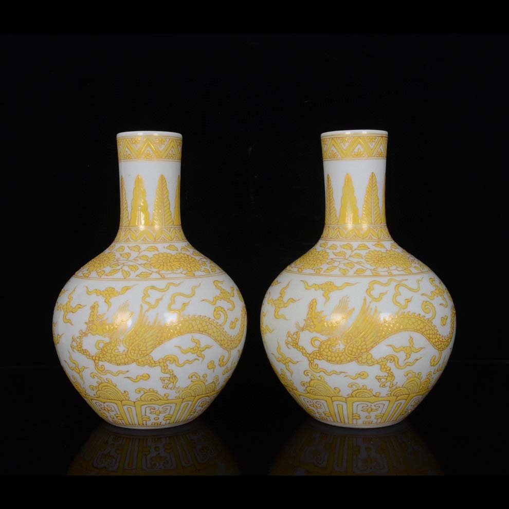 A Pair of Chenghua Celestial Ball Vases with Yellow Color and Gold Flying Dragon Pattern: A Pair of Chenghua Celestial Ball Vases with Yellow Color and Gold Flying Dragon Pattern.
