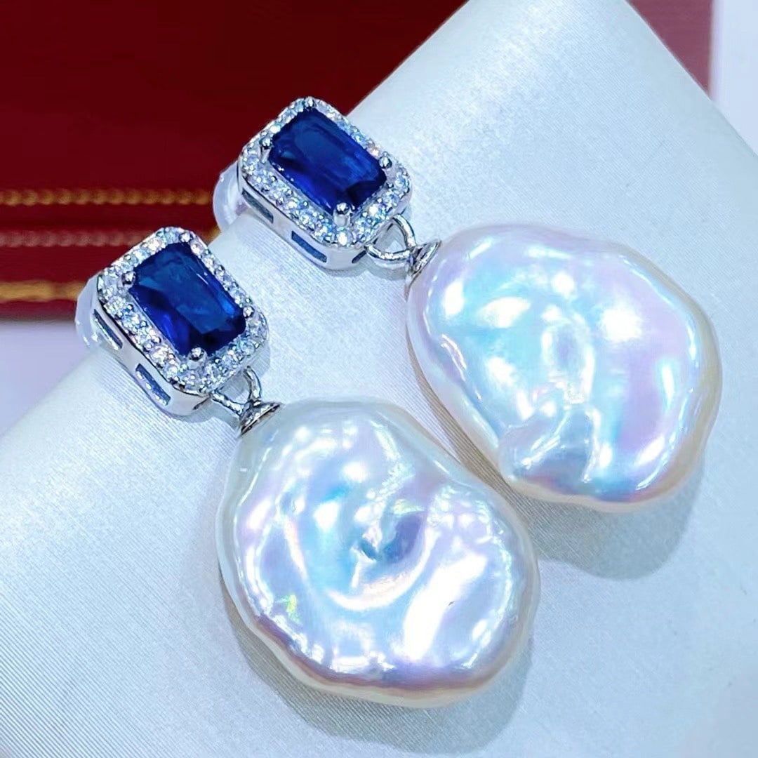 Natural Baroque 15*20MM pearl earrings: Aurora, sterling silver sapphire earrings Freight: 1.International Freight: Foreign shipping charges are determined by destination. 2.Photos, descriptions and valuations have been meticulously prepare