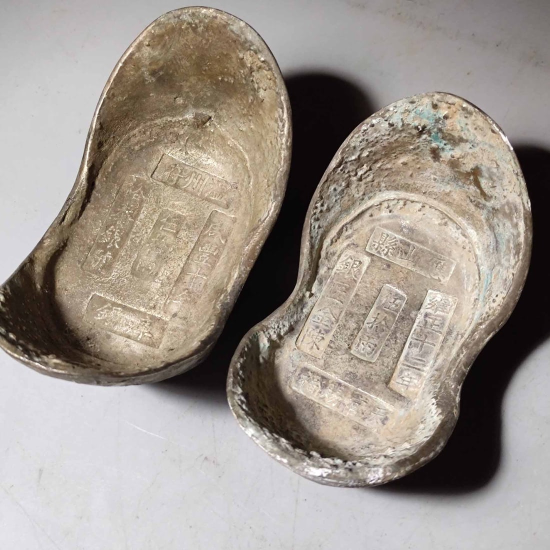 A pair of Qing Dynasty silver ingots of fifty taels (1 of 9)