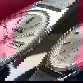 1972 Made in Japan Seiko 5 ACTUS Automatic Watch: Product Name: SEIKO 5 ACTUS SS Automatic 21 Jewels, manufactured in Japan in 1972, stainless steel case 7109-8010Silver sunburst dial with bar indexes, brand new leather strapCase width: approximately