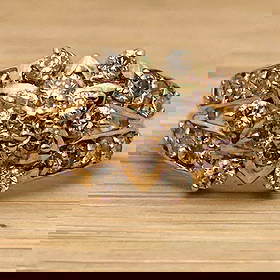 18k Gold Natural Diamond 1.00 Carat Ring: This is an 18k gold ring inlaid with natural diamonds.Size 10Weight: approximately 4.4 grams, these diamonds are brown, but they do not sparkle as much as pave diamonds because they are not as small.