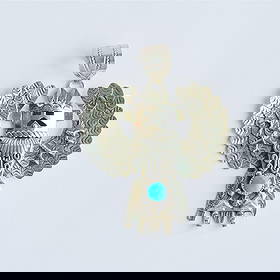 Vintage Navajo Eagle Dancer Turquoise Pendant: Vintage Navajo Eagle Dancer Turquoise Pendant Top. A striking Kachina pattern pendant designed by Navajo artist Alonzo Mariano. The design features the Eagle Dancer, symbolizing the soul, and strongly