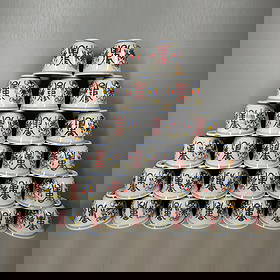 Porcelain cup with thin-body doucai and longevity character pattern, made during the Chenghua era of: This set of thin-walled Doucai longevity character pattern tea cups from the Chenghua period of the Ming Dynasty consists of 27 pieces, with each cup being 5 centimeters tall and 6.3 centimeters wide.