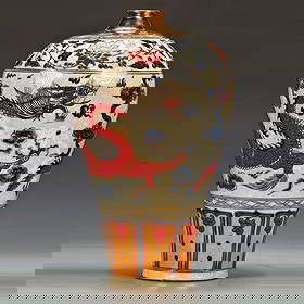 Early to Mid-Ming Dynasty Underglaze Blue and Gold with Iron-Red and Raised Colours 'Dragon Piercing: A blue-and-white porcelain vase with gold accents and red overglaze depicting a dragon piercing through clouds from the early to mid-Ming dynasty, before the 'blank period'. Height 45, width 26 centim