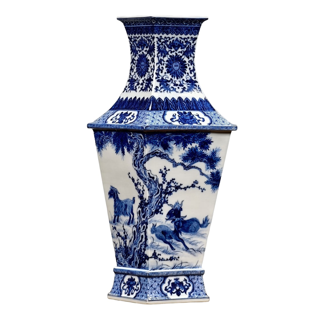 Qing Dynasty Qianlong Style Blue and White Quadrangular Square Bottle: Qing Dynasty Qianlong style blue and white porcelain square bottle with a four-sided design featuring interlocking lotus flowers and a window motif, featuring pine and plum trees and auspicious sheep.