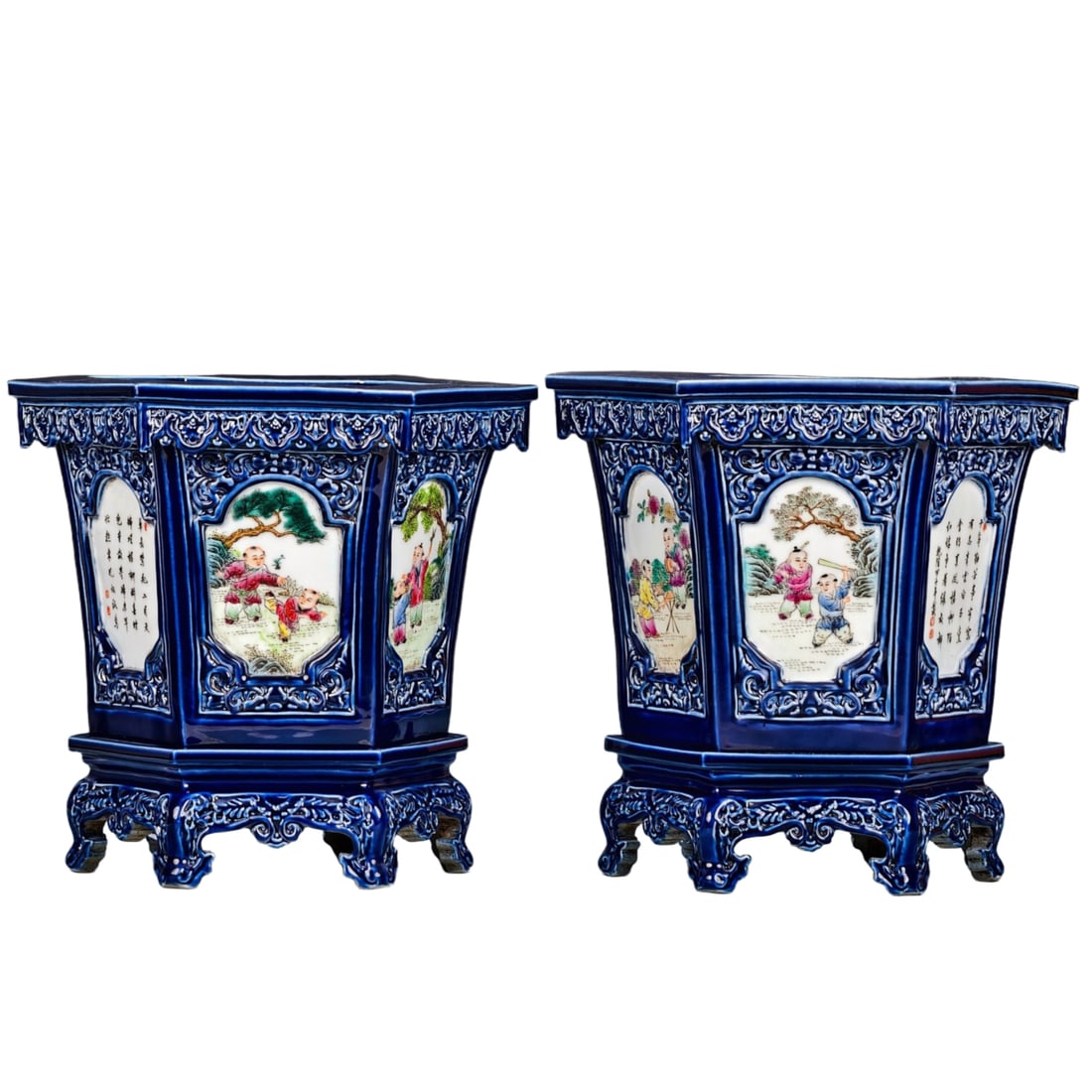 Pair of Qianlong-style, gemstone blue glaze, hexagonal windowed flowerpots: A pair of Qing Dynasty Qianlong style gem blue glaze six-sided open window porcelain flowerpots with children playing patterns. Height 33cm, width 34cm. The flowerpots in the picture are exquisitely c
