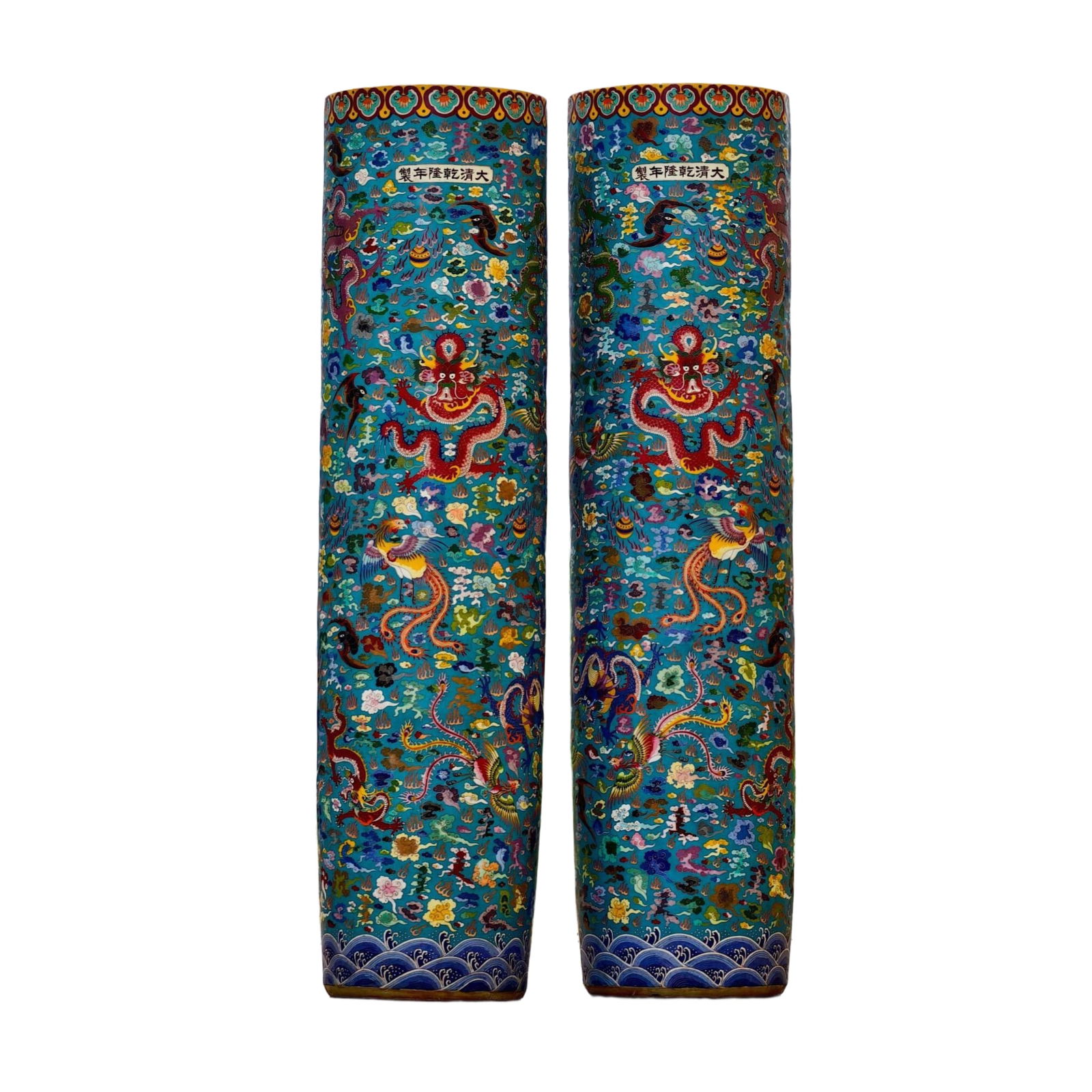 A pair of Qianlong-style Cloisonné feng shui columns from the Qing Dynasty: A pair of large-sized, floor-standing, wind-and-water columns featuring the Qianlong style of the Qing Dynasty, intricately designed with cloisonné enamel and nine dragons and nine phoenixes interwov
