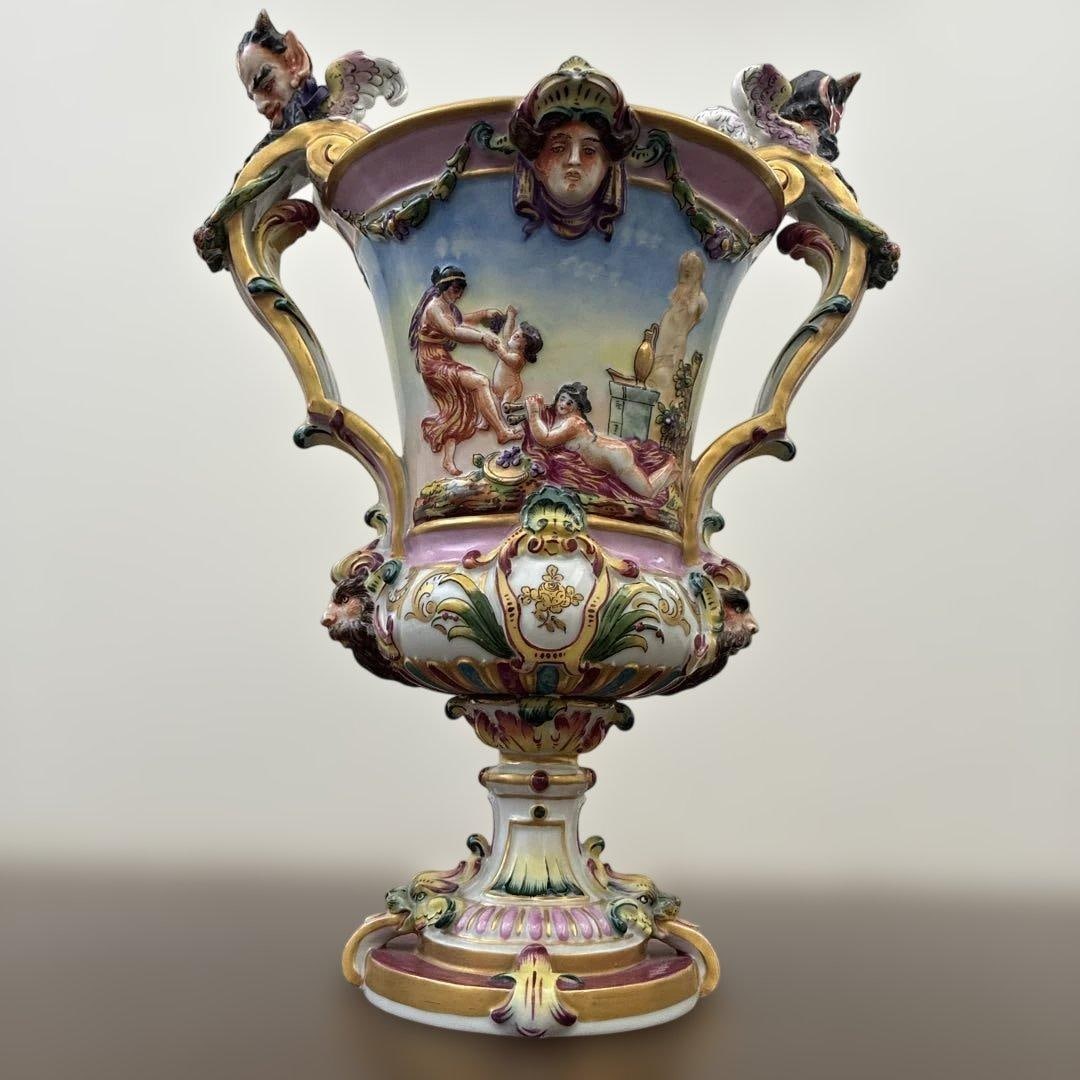 German Antique Decorative Vase: This is an antique German porcelain decorative vase. The mark at the bottom of the vase in Photo 6 comes from the oldest Volkstedt Porcelain Factory shown in Photo 7.'The oldest Volkstedt Porcelain Fa