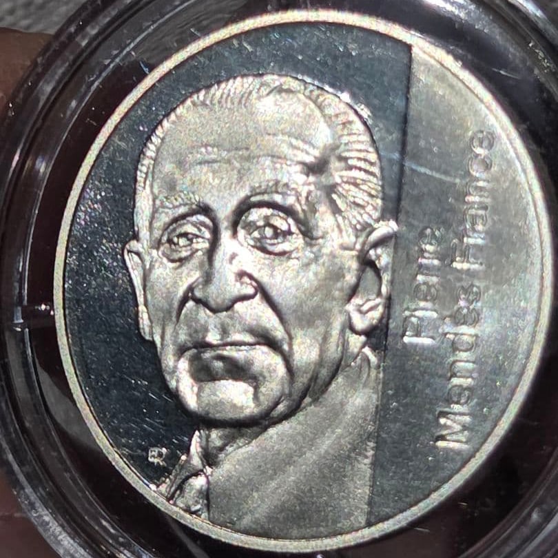 10th Anniversary of the Death of Pierre Mendès France - 5 Franc Silver Coin 1992: This is a silver coin issued by France in 1992 to commemorate the 10th anniversary of Pierre Mendès's death.Pierre Mendès (January 11, 1947 - October 18, 1982) was a politician who was credited