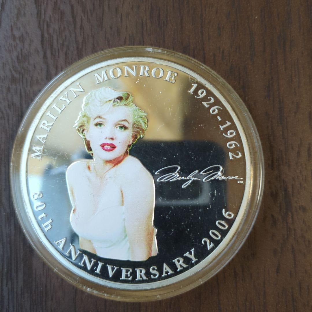 Marilyn Monroe's 80th Birthday Anniversary 2006: This Marilyn Monroe 80th Anniversary commemorative coin was issued to honor her life from 1926 to 1962. The coin, released in 2006, features her finely designed portrait on the front. Brand: Marilyn M