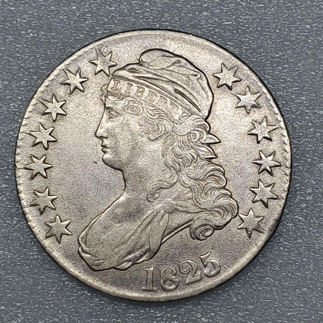 Rare, excellent condition 1825 United States half dollar silver coin: This is a U.S. 50-cent coin issued in 1825, featuring an image of the Statue of Liberty. Year: 1825Country: United StatesFace Value: 50CDesign: EagleTheme: LibertyDamage: Minor scratchesSize: Approxim