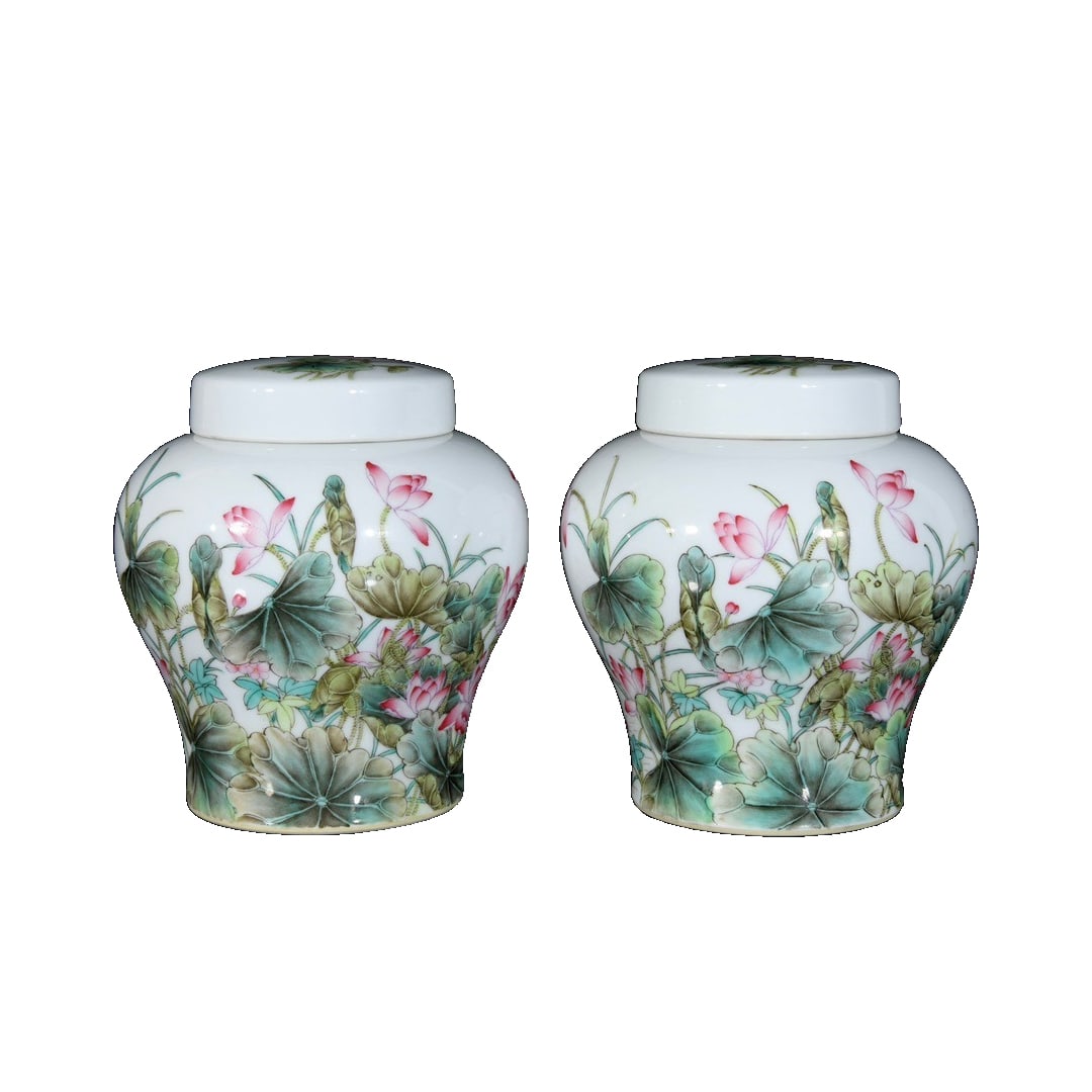 A pair of Qianlong-style cloisonné enamel vases with floral, bird, and crane motifs and lotus: This Qianlong period cloisonné enamel vase with crane, lotus and bird design, is well-proportioned, with dimensions of 16×14.5 centimeters. The body of the vase is adorned with vibrant and delicate