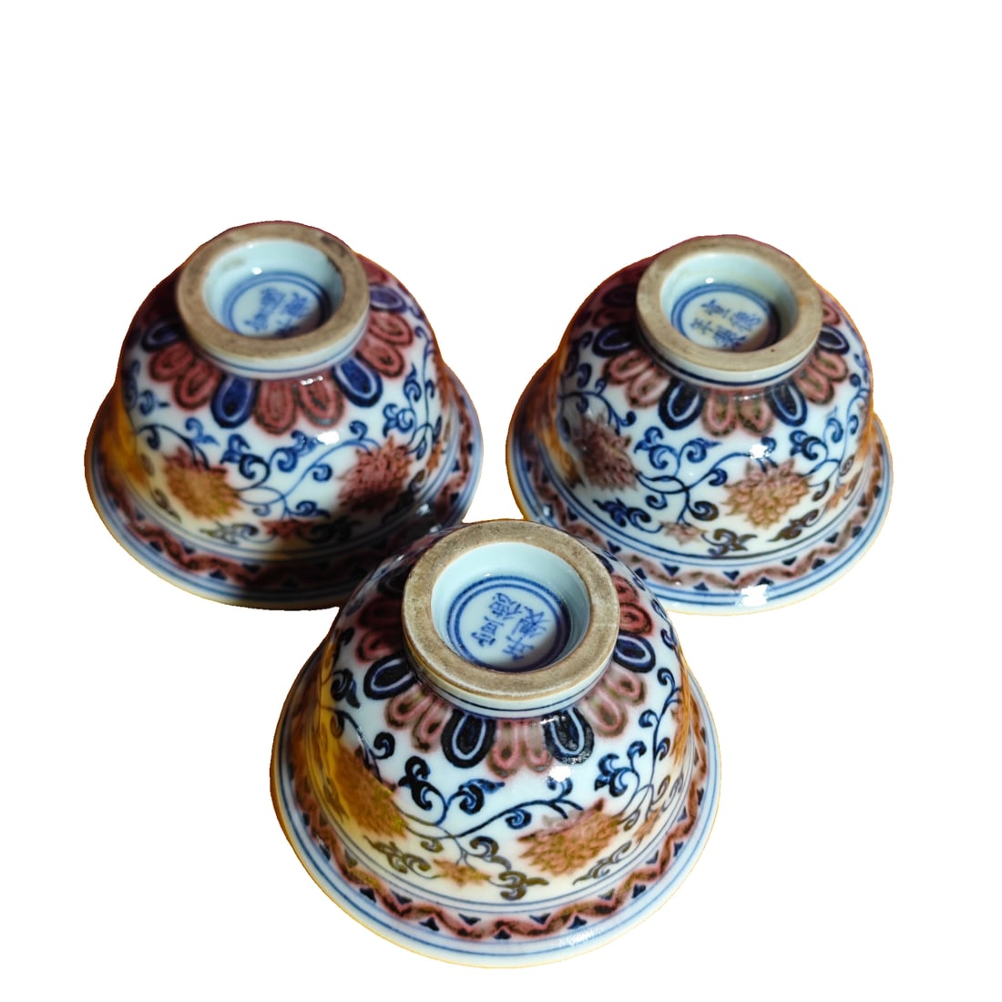 Xuande style underglaze red and blue hand-pressed cup of Ming Dynasty: This blue and white porcelain cup with red underglaze, a style from the Ming Dynasty Xuande period, measures approximately 5.5 centimeters in height and 9.3 centimeters in width, with a delicate and