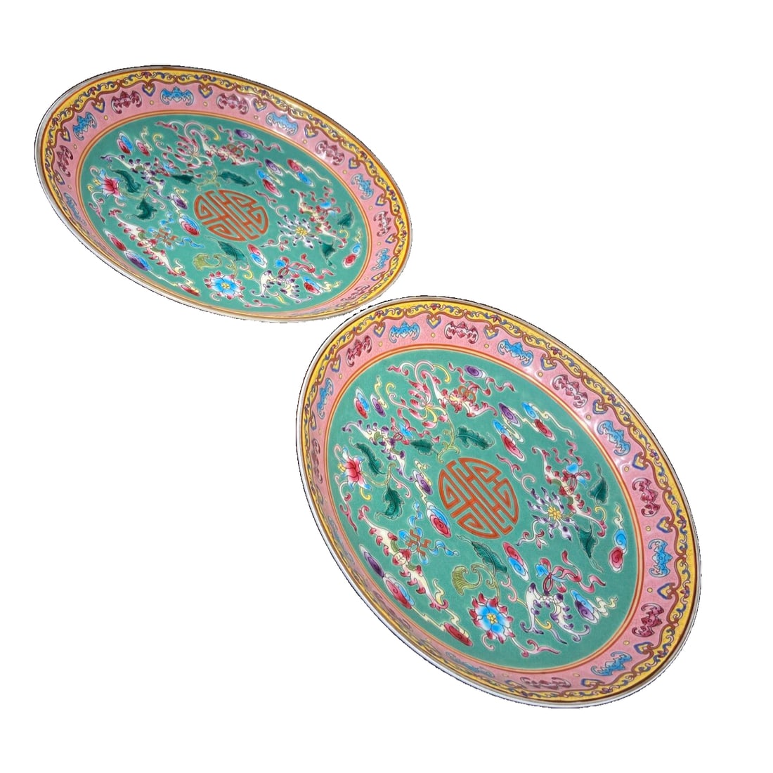 A Pair of Enamel Porcelain Plates with Green Glaze and Floral Motifs for Birthday Wishes: A pair of famille rose porcelain plates with a pale green ground and floral floral design, symbolizing longevity and good fortune. The base features a pair of large blue dragons. The plates are fully