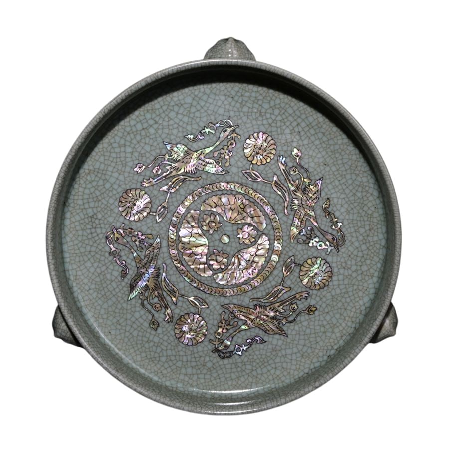 Song Dynasty Style Glaze with Official Inscription Inlaid with Shell and Crane Pattern Three-legged: This Song Dynasty Ru ware tripod washer with the imperial mark is 5.5 cm high and 19.5 cm wide. It is made using Ru ware techniques, bears the imperial mark, is inlaid with seashells and decorated