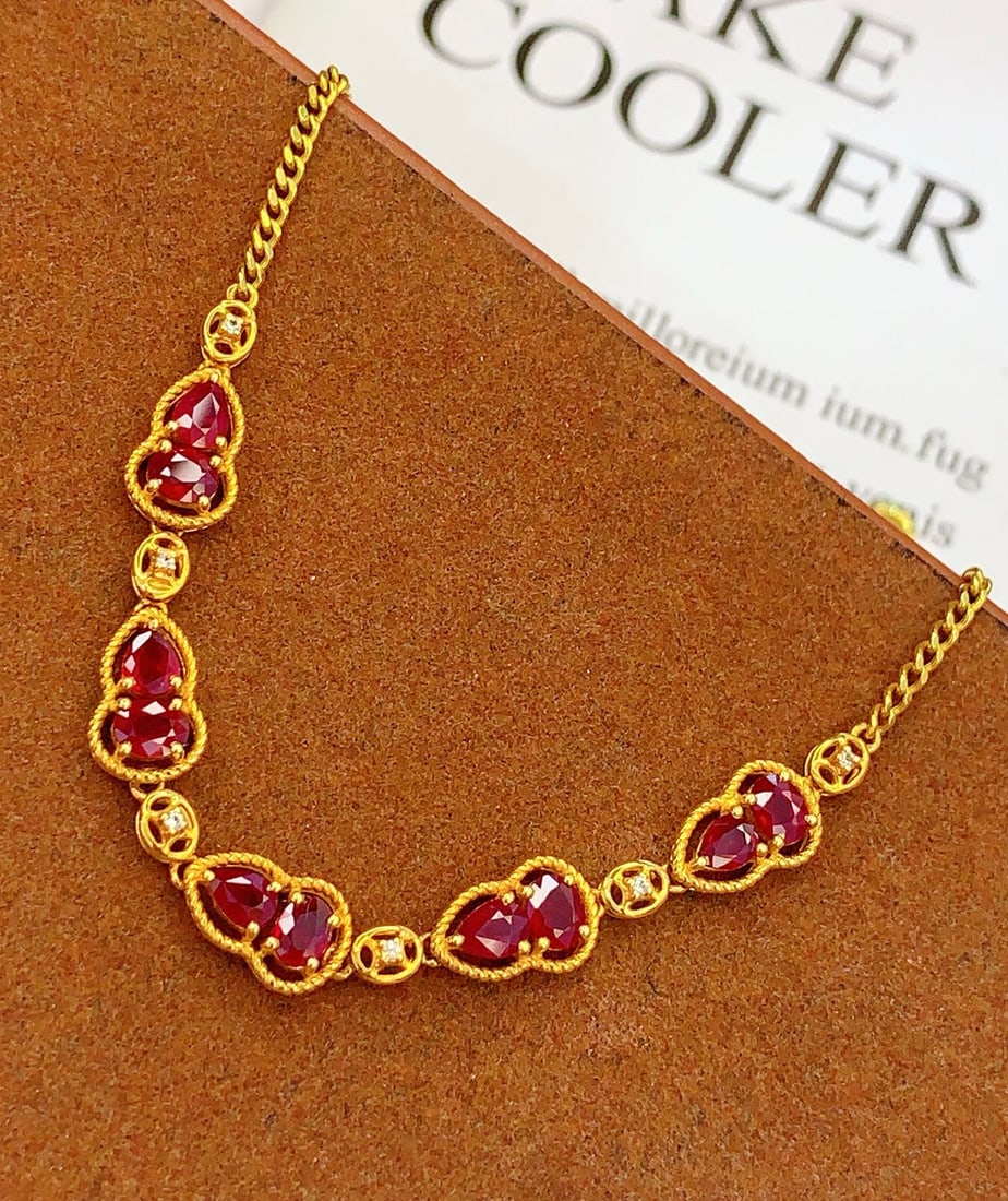 18k Natural Ruby Bracelet: 18k Natural Ruby BraceletTotal Weight: 3.74 gramsMain Stone: 4.86 caratsWhite Sapphires: 6 pieces