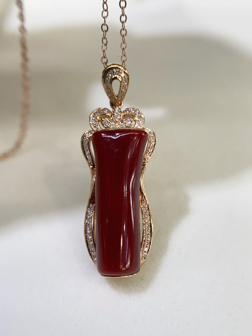 18K Gold Plated Pendant with South African Diamonds and Red Coral: Red Coral PendantAka Black Ox Blood Faceted Bead18k Gold Cladding with South African DiamondsGlassy texture, clear and lustrousNaked stone size 8.4×21.4mm